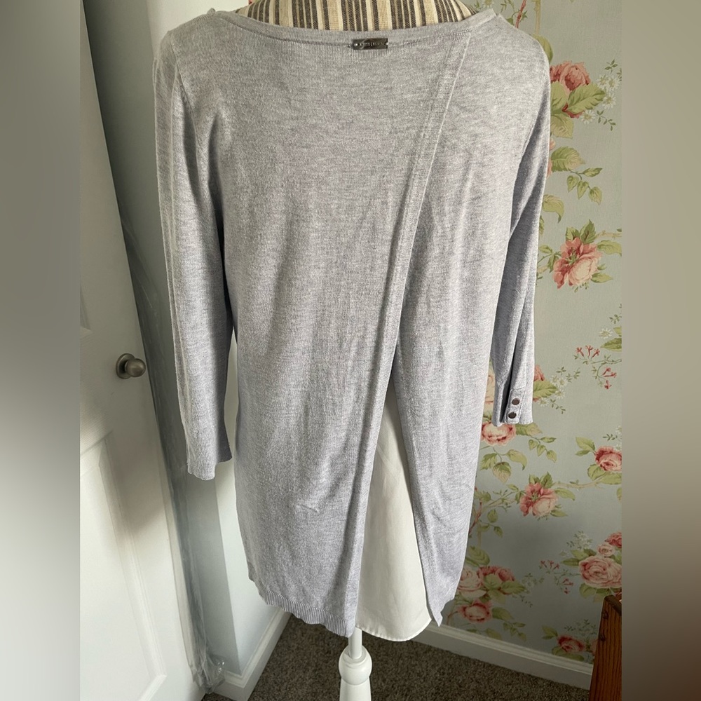 Very cute dressy tunic style sweater with stylish sheer inset in the back.
